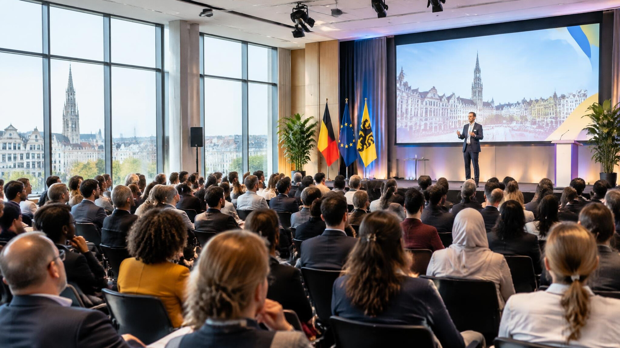 Professional conference room with attendees listening to a speaker
