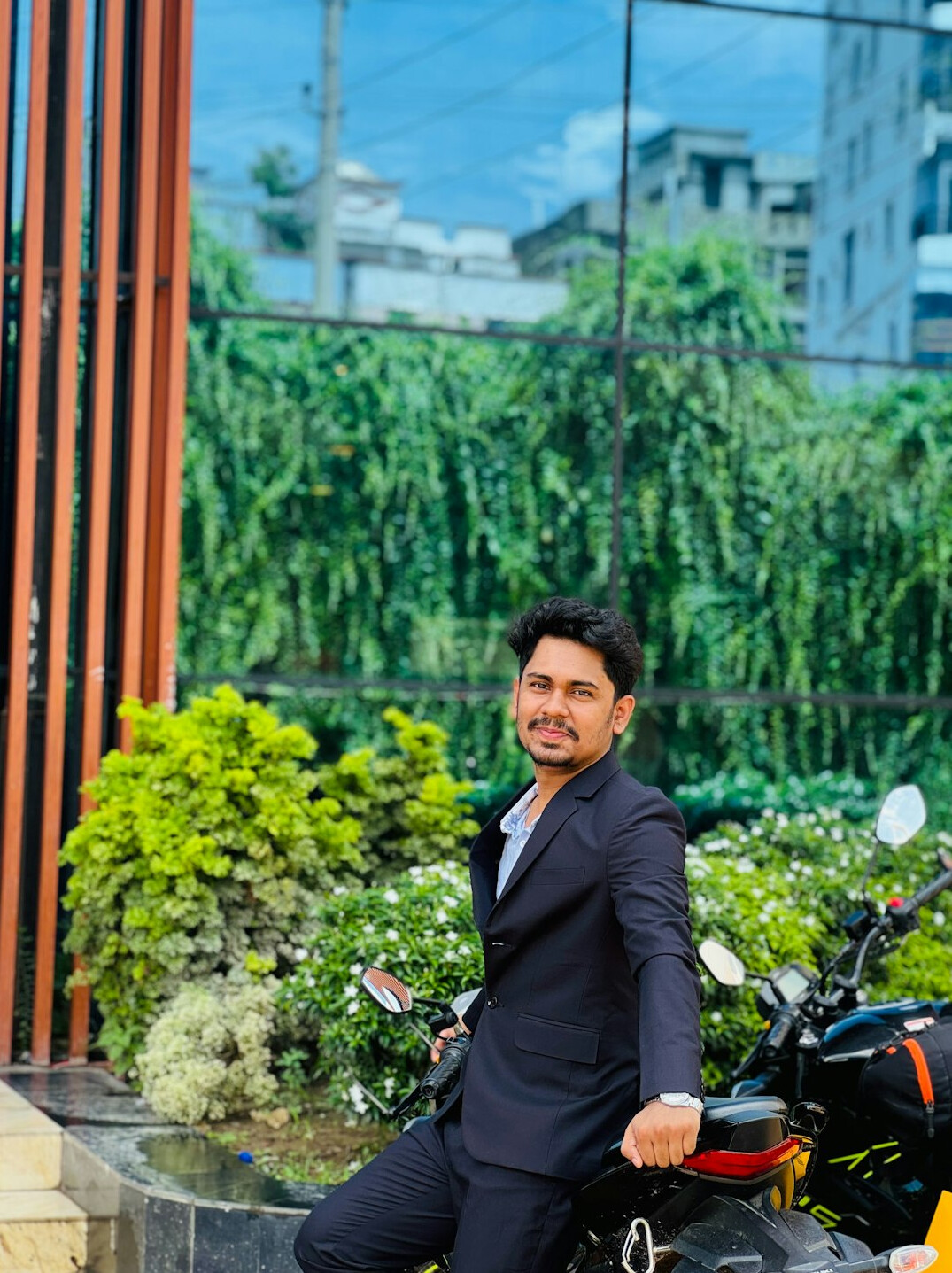 Portrait of a man in a suit with a confident smile
